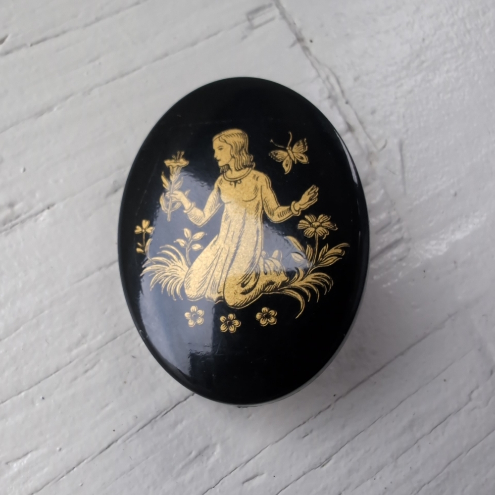 Vintage mid century black and gold girl butterfly garden cabochon brooch
